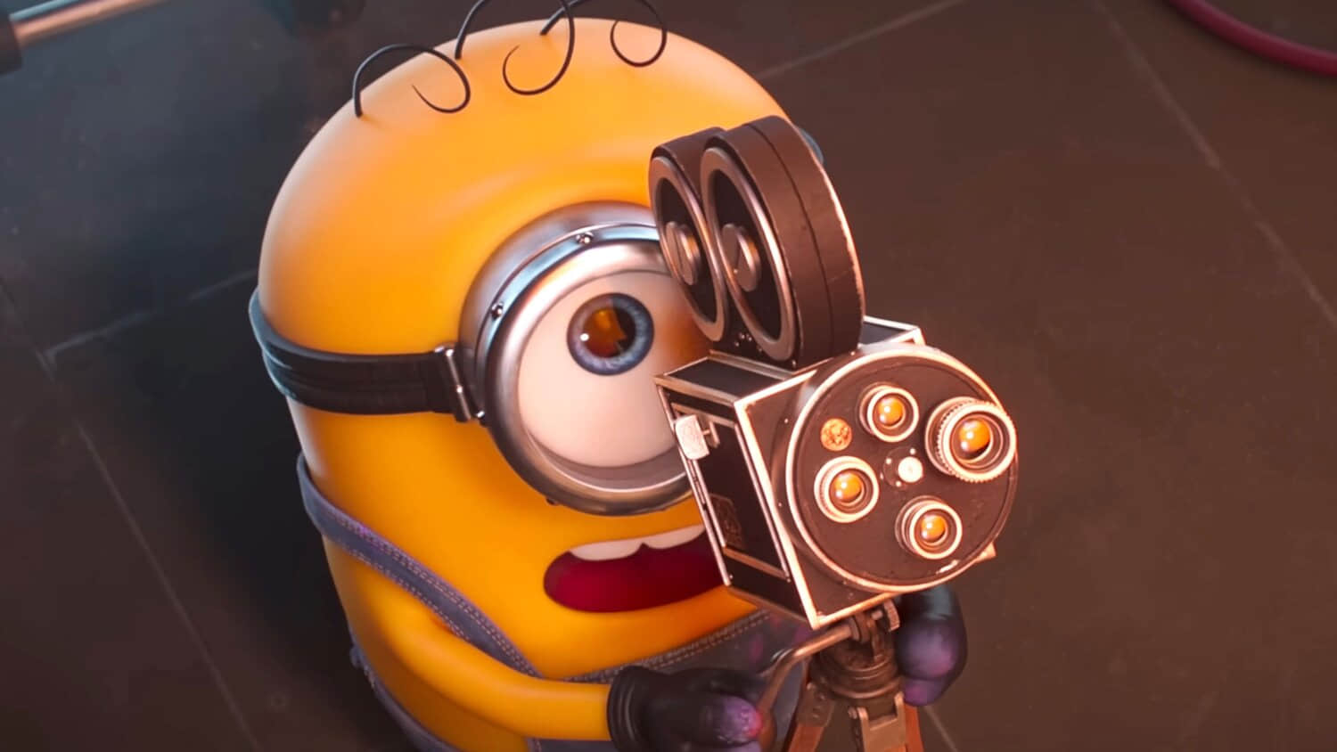 james-looking-up-in-shock-while-pointing-a-camera-in-minions-monsters.jpeg