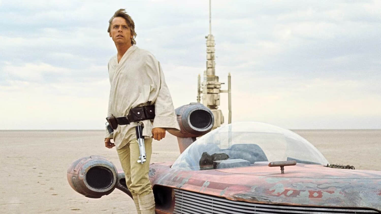 luke-skywalker-standing-next-to-a-speeder-on-tatooine-in-a-new-hope.jpeg