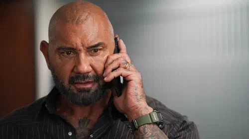 assets/dave-bautista-looking-intense-while-on-his-phone-in-trap-house.jpeg