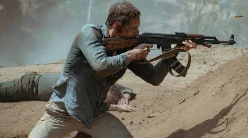 assets/michael-fassbender-shooting-a-gun-in-the-agency-season-2.jpeg