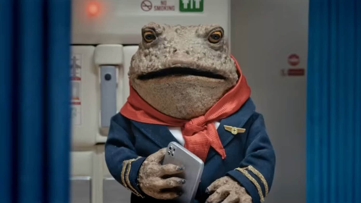 a-toad-flight-attendant-looking-shocked-holding-a-phone-in-the-end.jpeg