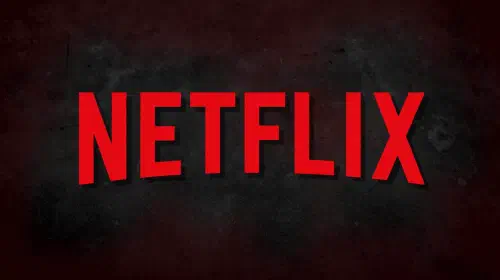 assets/the-netflix-logo-is-in-front-of-a-grungy-black-and-dark-red-background.jpeg