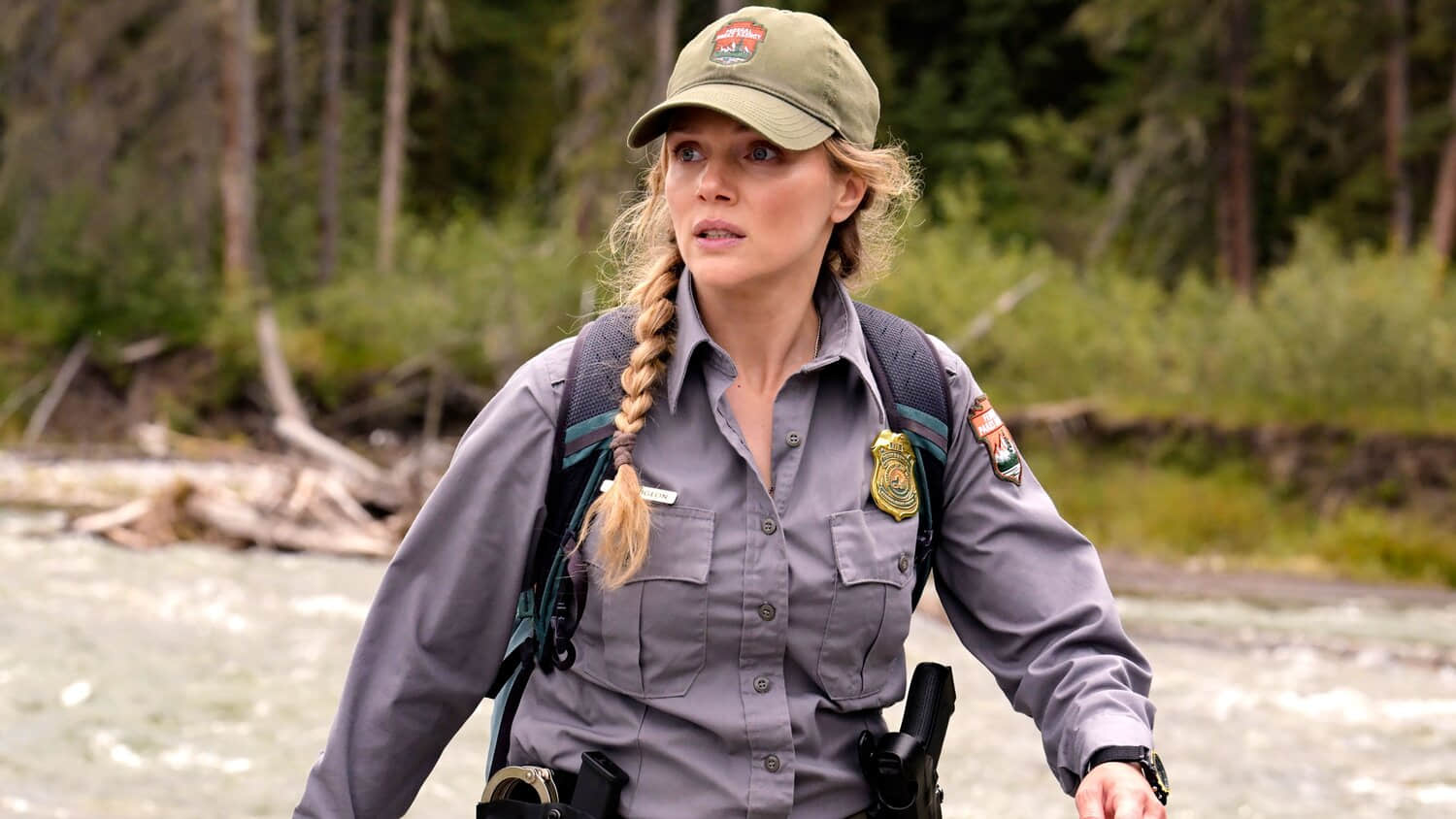 tracy-spiridakos-anna-looking-worried-standing-near-a-ravine-in-anna-pigeon.jpeg