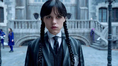 assets/jenna-ortega-as-wednesday-addams-looking-glum-at-nevermore.jpeg