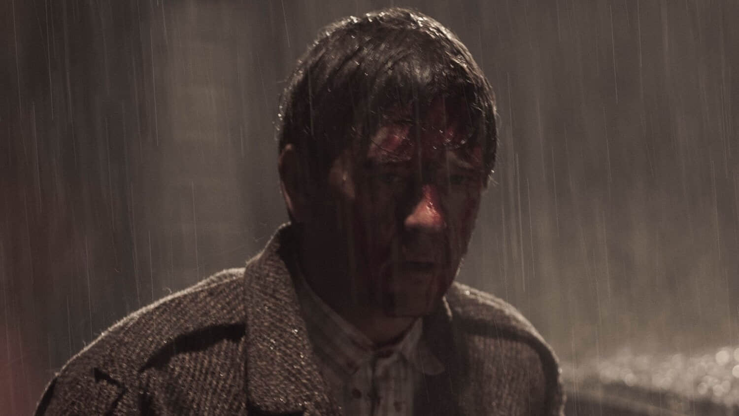 a-man-stands-in-the-rain-in-dark-2017.jpeg