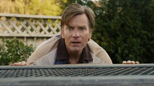 assets/ewan-mcgregor-with-a-wide-eyed-panicked-expression-in-the-end-of-oak-street.jpeg