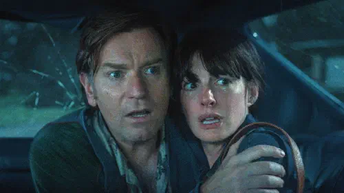 assets/ewan-mcgregor-and-anne-hathaway-looking-scared-in-the-end-of-oak-street.jpeg