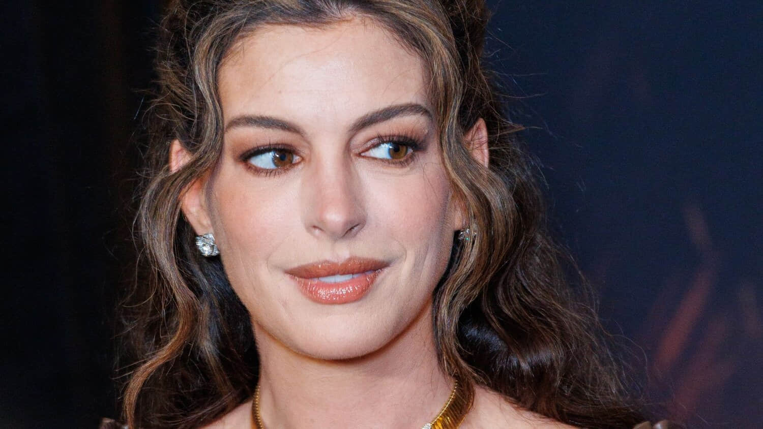 a-close-up-of-anne-hathaway-on-a-red-carpet.jpeg