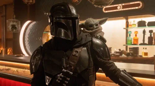 assets/the-mandalorian-and-grogu-standing-in-a-bar-in-the-mandalorian-and-grogu.jpeg