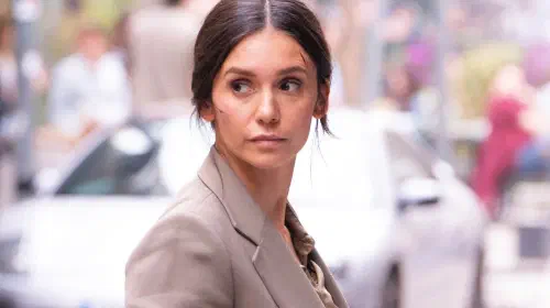 assets/nina-dobrev-looking-behind-in-the-bricklayer.jpeg