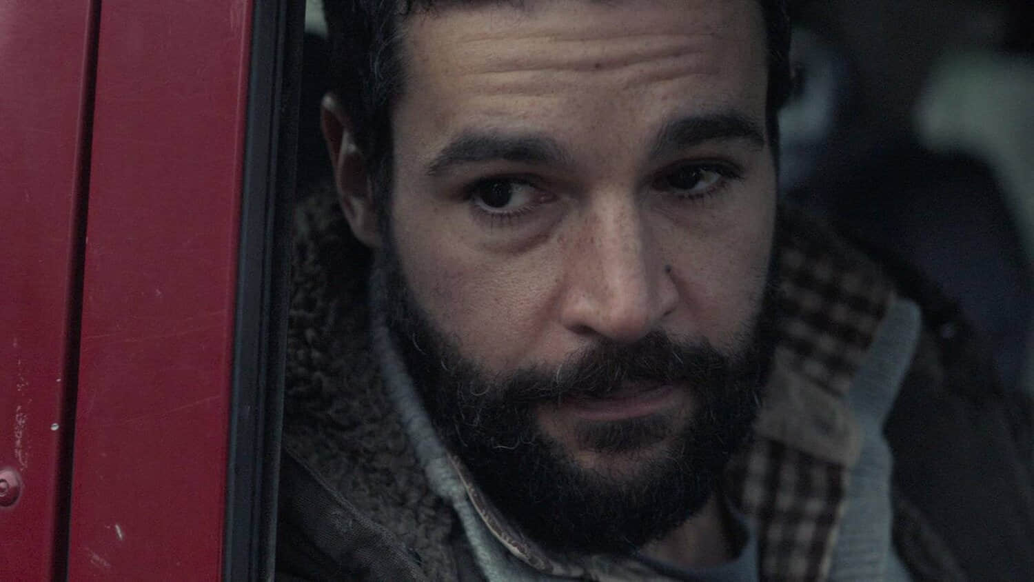 christopher-abbott-in-a-car-seat-in-the-2025-movie-bring-them-down.jpeg