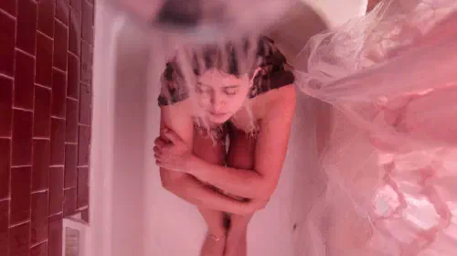 assets/a-woman-takes-a-bath-in-the-docudrama-a-child-of-my-own.jpeg