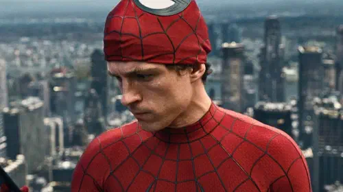 assets/tom-holland-looking-at-phone-in-spider-man-brand-new-day.jpeg
