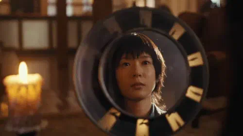 assets/moeka-hoshi-looking-at-herself-in-the-mirror-in-never-after-dark.jpeg