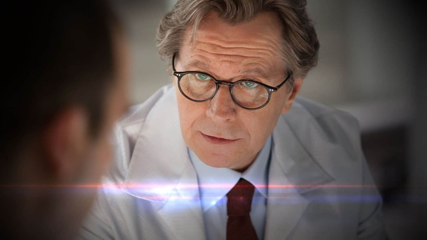 gary-oldman-leaning-forward-in-robocop-2014.jpeg