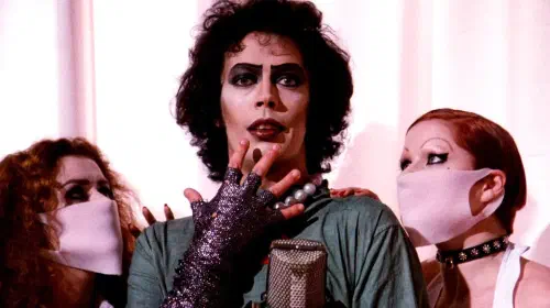 assets/tim-curry-with-two-assistants-in-the-rocky-horror-picture-show.jpeg