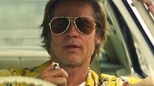 assets/brad-pitt-as-cliff-booth-driving-car-in-once-upon-a-time-in-hollywood.jpeg