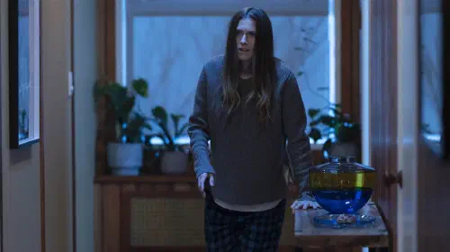 assets/allison-williams-walking-down-a-hallway-in-m3gan.jpeg