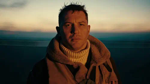 assets/tom-hardy-s-farrier-looking-intently-at-the-plane-on-fire-in-dunkirk.jpeg