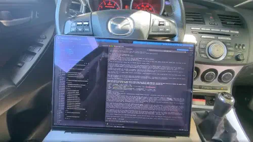 assets/Using-a-laptop-to-run-LLM-to-diagnose-a-car-problem.jpeg
