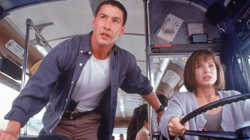 assets/keanu-reeves-and-sandra-bullock-next-to-each-other-in-speed.jpeg