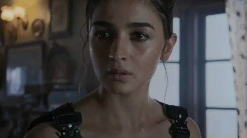 assets/woman-looking-serious-in-alpha.jpeg