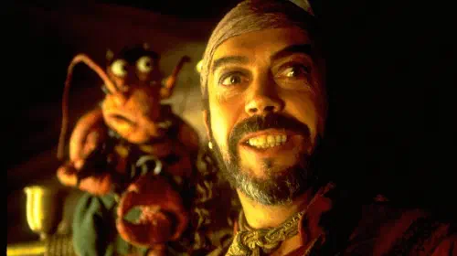 assets/tim-curry-grinning-as-long-john-silver-in-muppets-treasure-island.jpeg