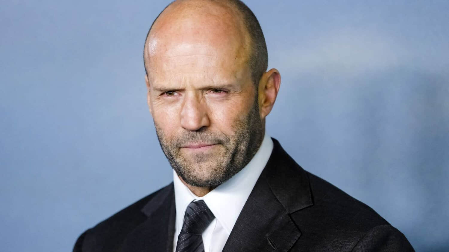 jason-stratham-posing-on-a-red-carpet.jpeg
