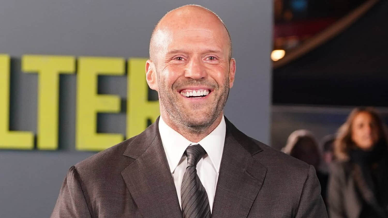 jason-statham-smiling-on-shelter-red-carpet.jpeg