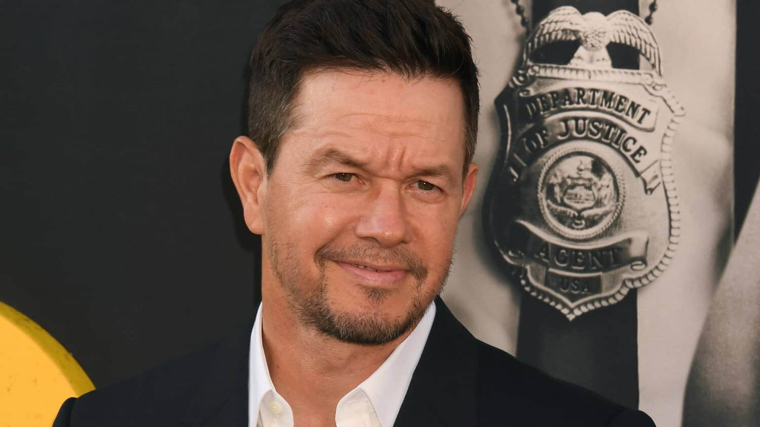 mark-wahlberg-posing-on-the-red-carpet-for-the-premiere-of-by-any-means.jpeg