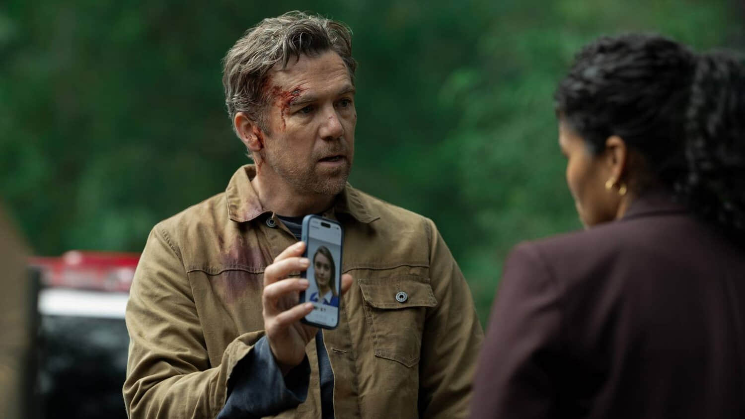 patrick-brammall-holding-up-his-phone-in-last-seen.jpeg