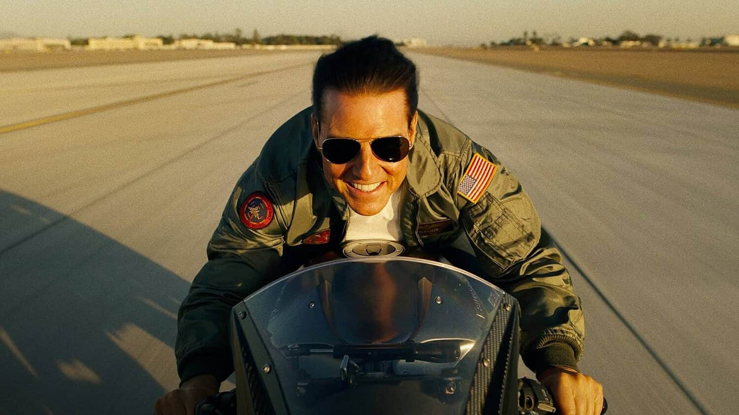 tom-cruise-on-a-motorcycle-in-top-gun-maverick.jpeg