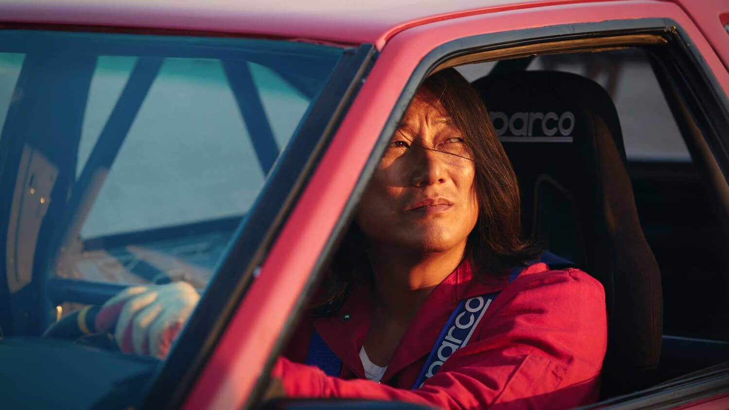 sung-kang-behind-the-wheel-of-a-red-car-in-drifter.jpeg