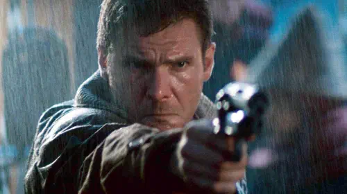 assets/harrison-ford-s-deckard-pursues-a-replicant-in-ridely-scott-s-blade-runner.jpeg