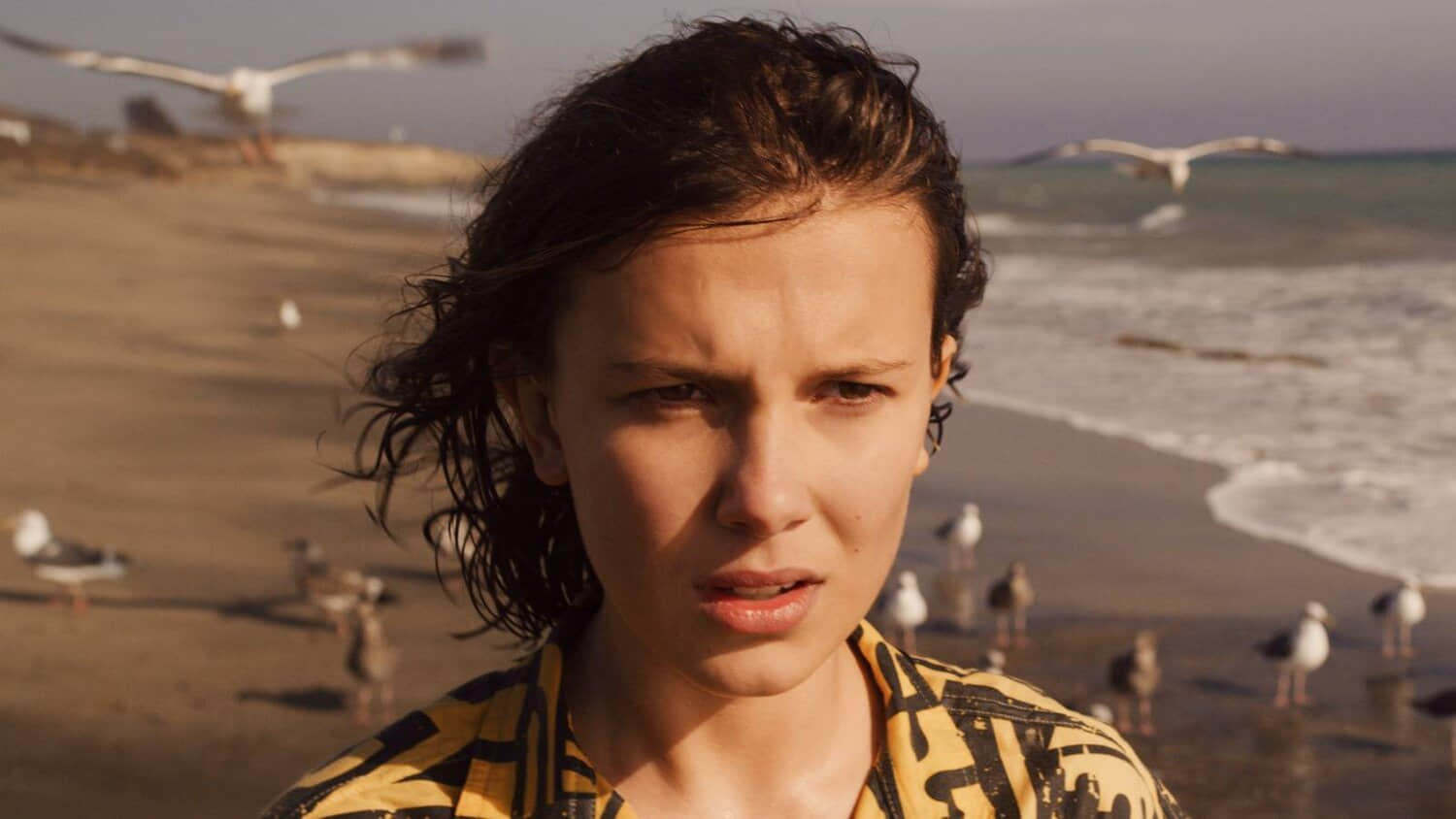 millie-bobby-brown-as-eleven-at-the-beach-in-stranger-things-season-3.jpeg
