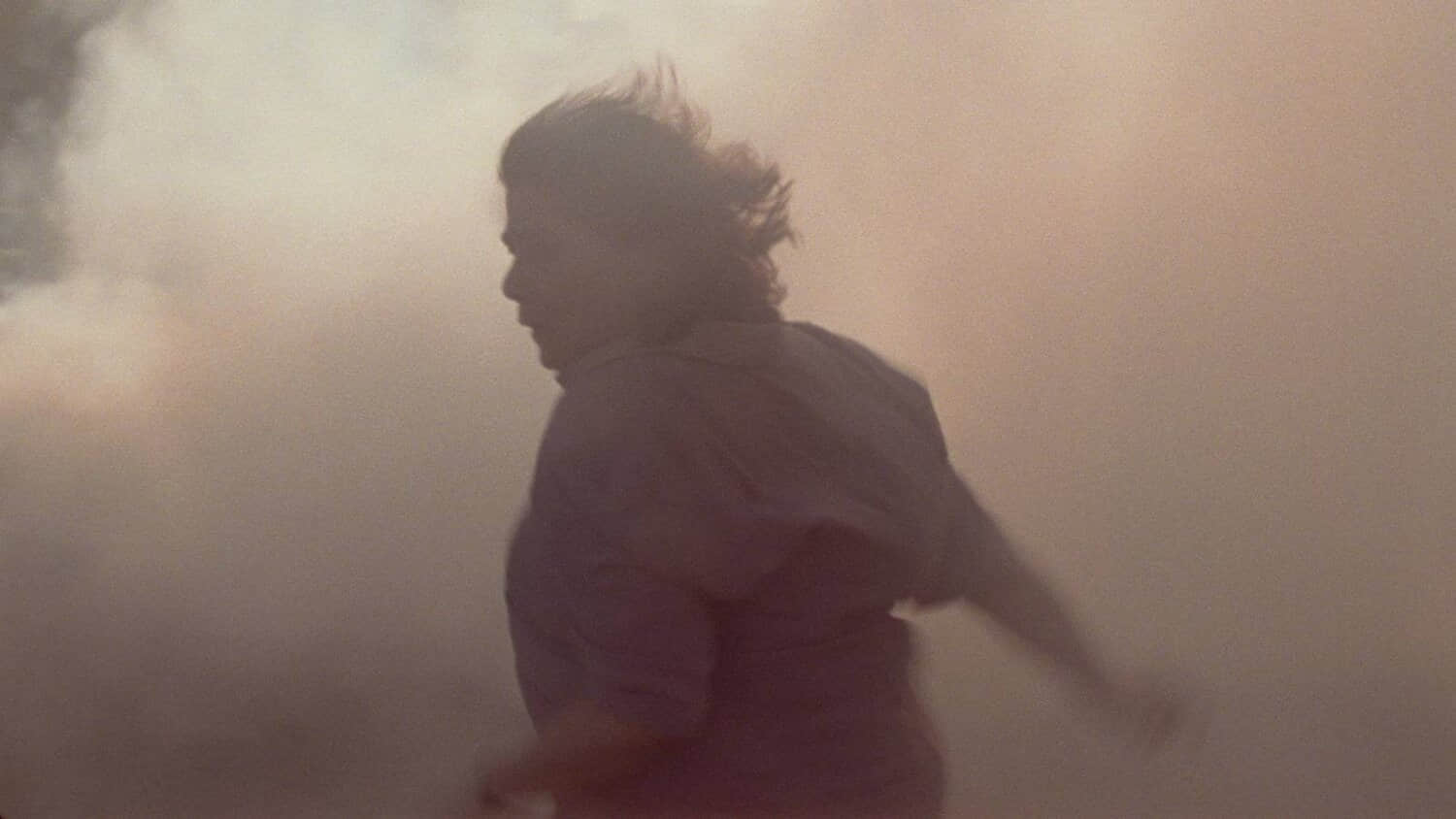 hiam-abbass-running-through-a-cloud-of-dust-in-atonement.jpeg