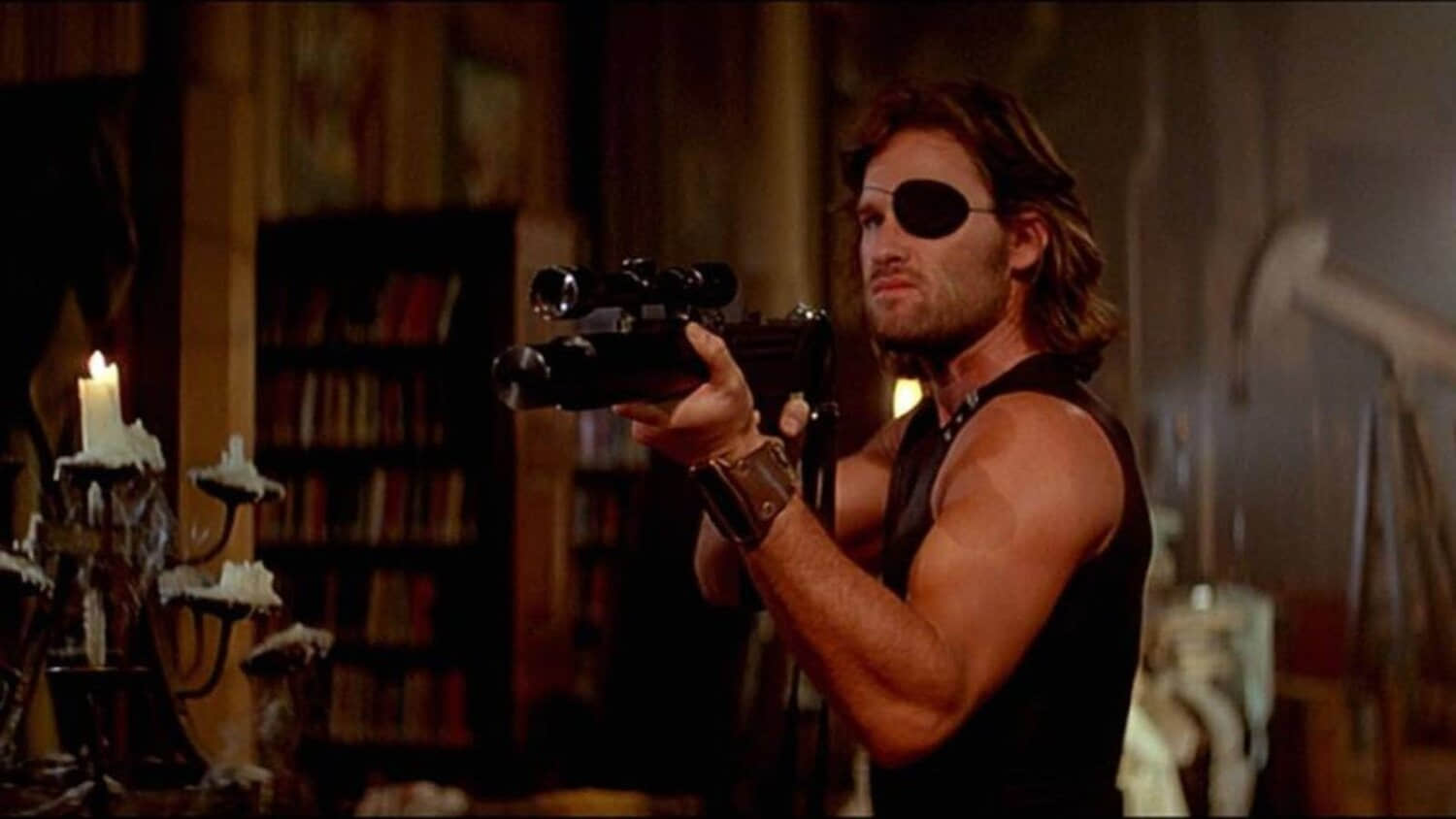 kurt-russell-as-snake-plissken-with-a-gun-in-escape-from-new-york.jpeg