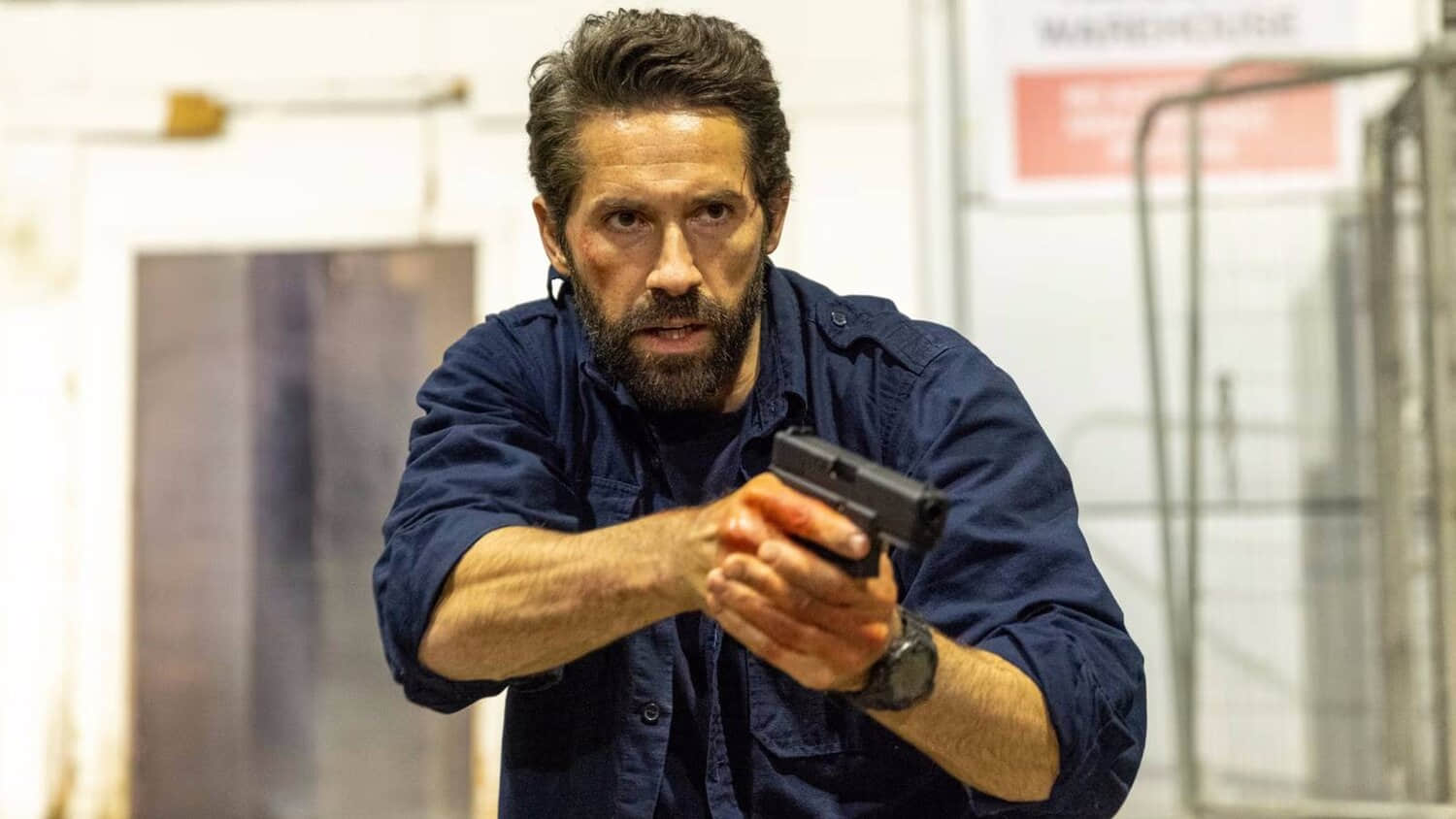 scott-adkins-holding-a-gun-in-one-more-shot.jpeg