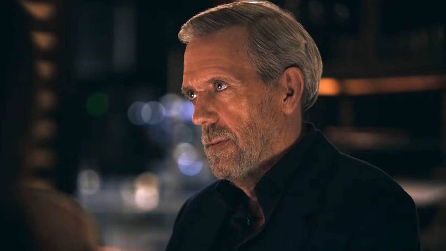 hugh-laurie-looking-to-the-side-in.jpeg