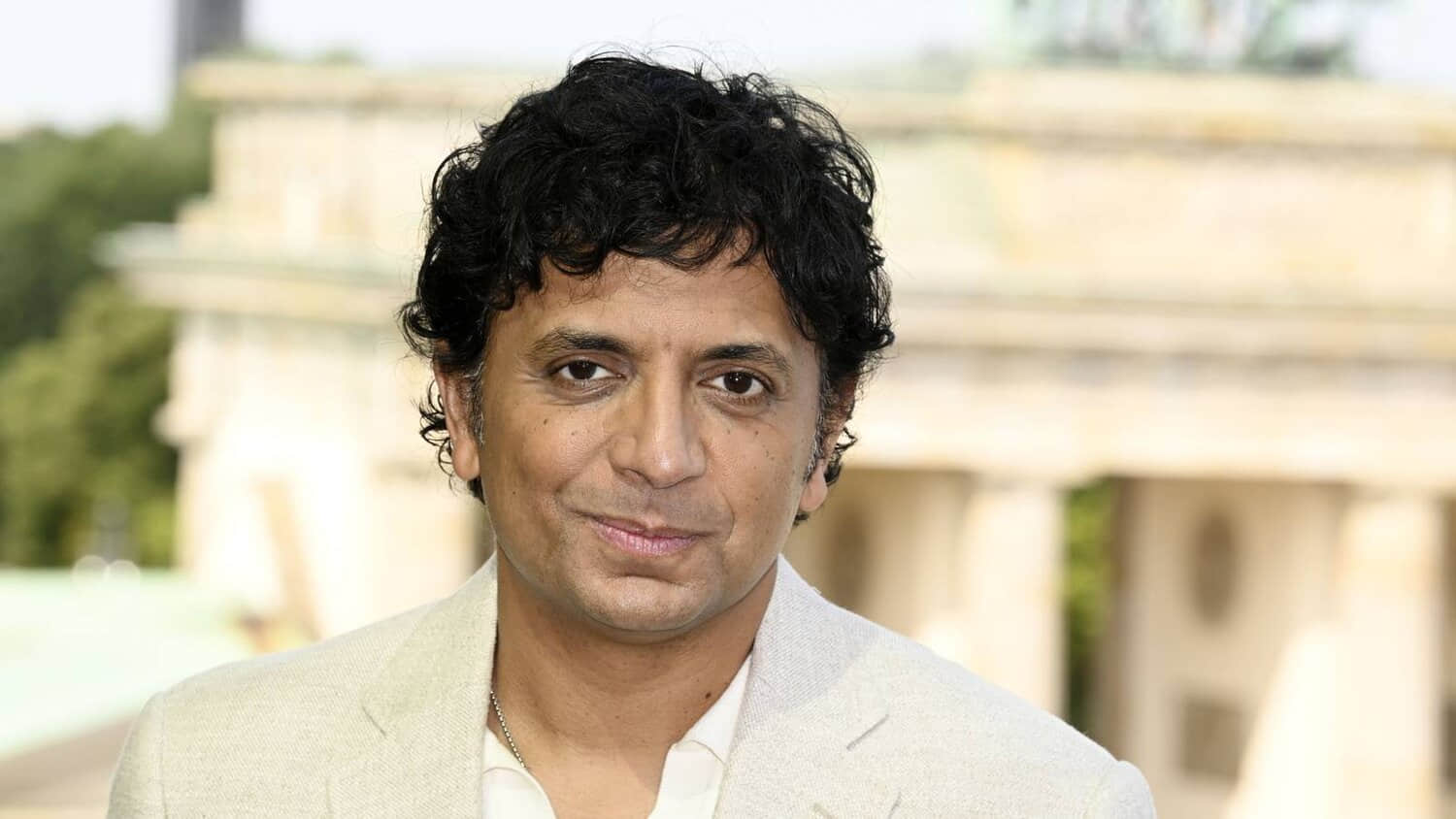 m-night-shyamalan-smiling-at-the-berlin-photo-call-for-trap.jpeg