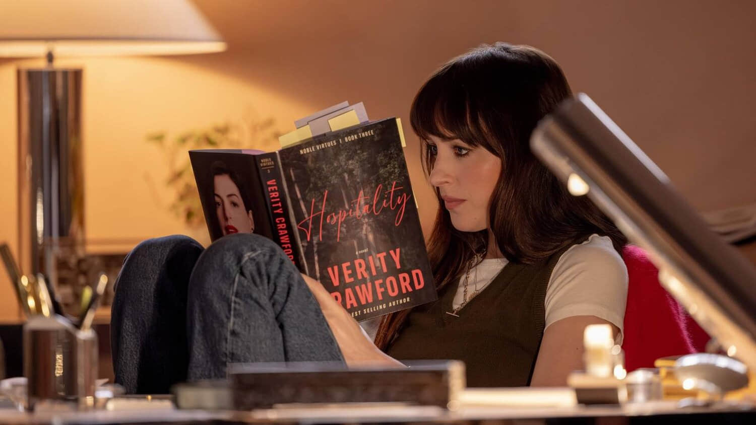 dakota-johnson-as-lowen-reading-a-book-in-verity.jpeg