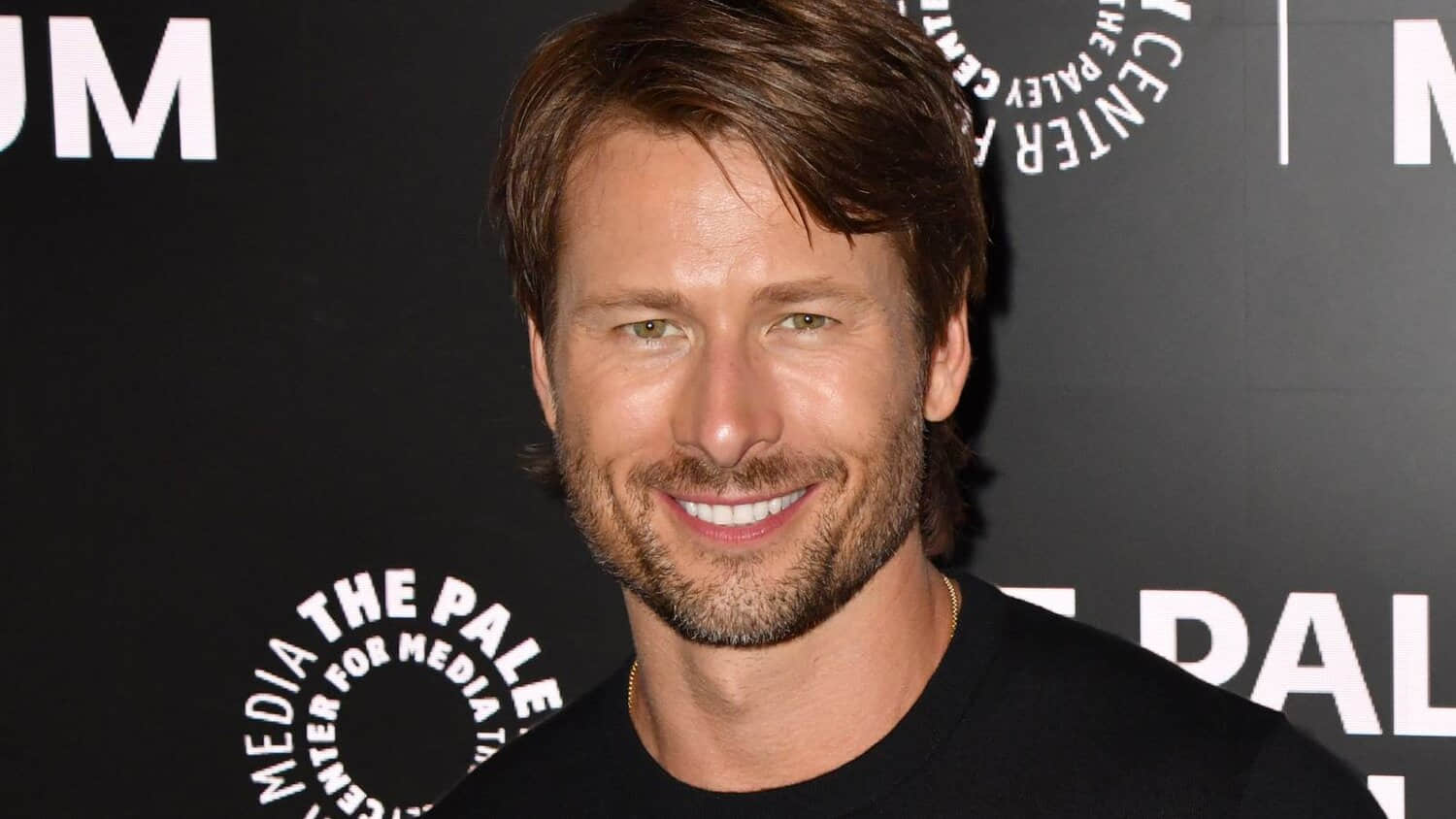 glen-powell-smiling-at-a-red-carpet.jpeg