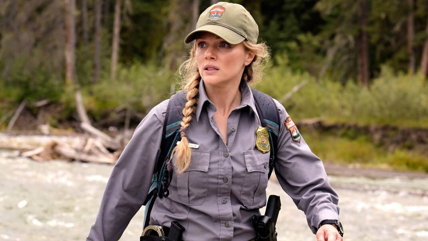 tracy-spiridakos-anna-looking-worried-standing-near-a-ravine-in-anna-pigeon.jpeg